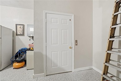 Second story condo with elevator. Covered balcony.  Large open