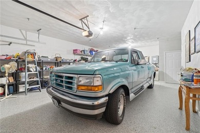 Second story condo with elevator. Covered balcony.  Large open