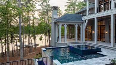 WELCOME TO THE PINNACLE OF LAKESIDE LUXURY, NESTLED WITHIN THE