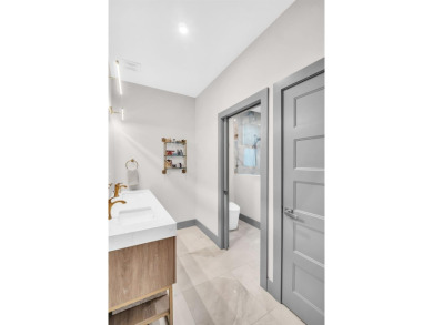 This magnificent 2-year-old home overlooks a 170-acre nature