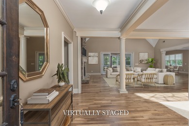 This stunning 4-bedroom, 4-bath home offers a refined living