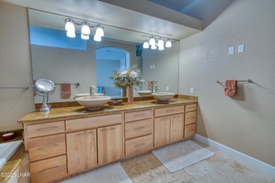 Welcome to 3481 Pocahontas Drive! This Elegant Custom home is