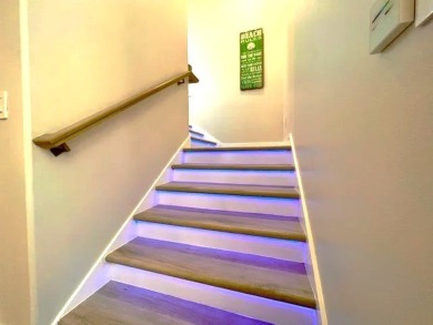 This LUXURIOUS BEACHFRONT smart home has it ALL! Three stories