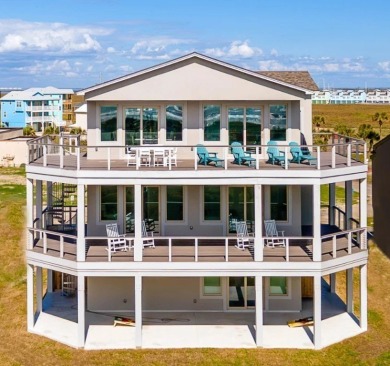 This LUXURIOUS BEACHFRONT smart home has it ALL! Three stories