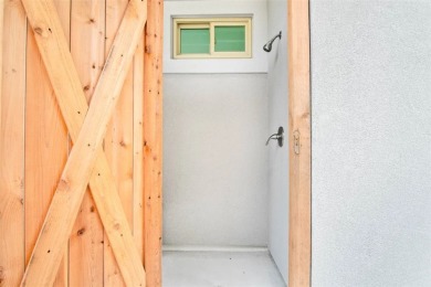 This LUXURIOUS BEACHFRONT smart home has it ALL! Three stories