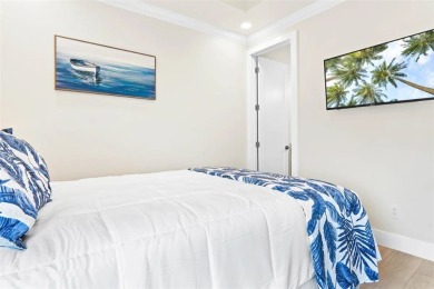 This LUXURIOUS BEACHFRONT smart home has it ALL! Three stories