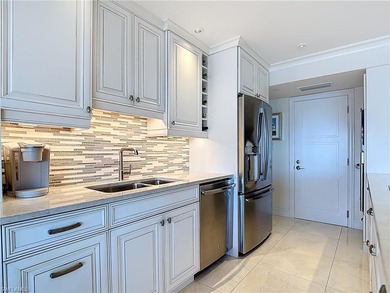 Now offering this designer updated condo in the heart of Naples!