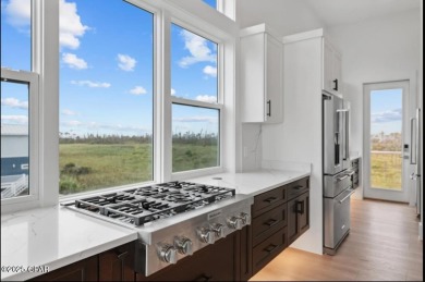 A SHOWSTOPPER of a home! Located in Secluded Dunes subd. This