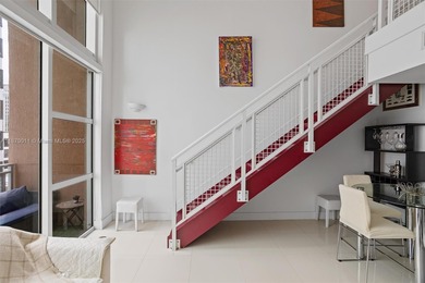 Stylish and spacious bi-level loft-style condo in the exclusive