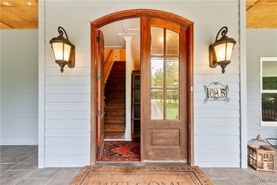 Nestled on the banks of the Black Warrior River, this 5 bedroom