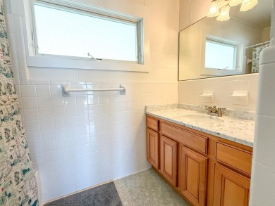 This charming ground level house on St. George Island offers the