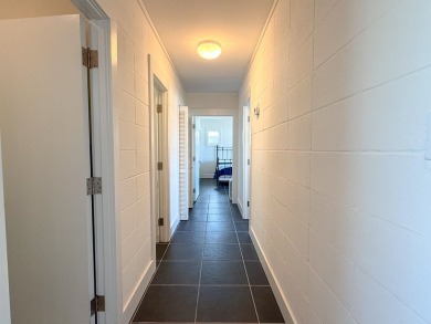 This charming ground level house on St. George Island offers the