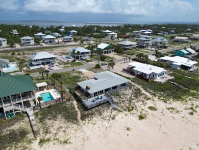 This charming ground level house on St. George Island offers the