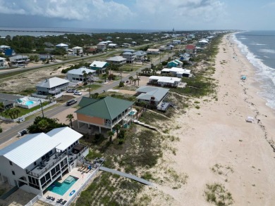 This charming ground level house on St. George Island offers the
