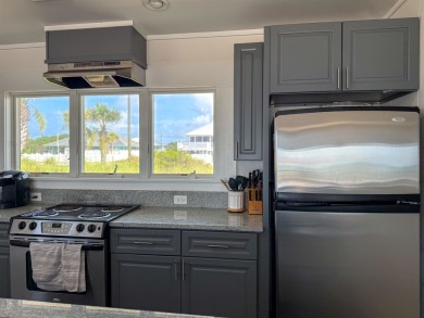 This charming ground level house on St. George Island offers the