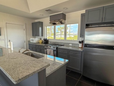 This charming ground level house on St. George Island offers the