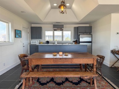 This charming ground level house on St. George Island offers the