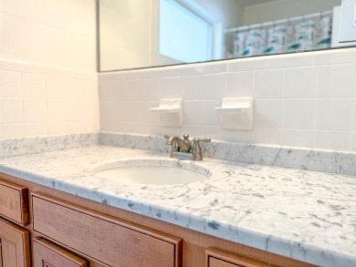 This charming ground level house on St. George Island offers the