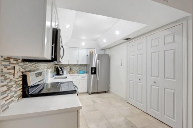 Enjoy the Florida lifestyle in this gorgeous 1st-floor condo in