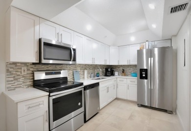 Enjoy the Florida lifestyle in this gorgeous 1st-floor condo in