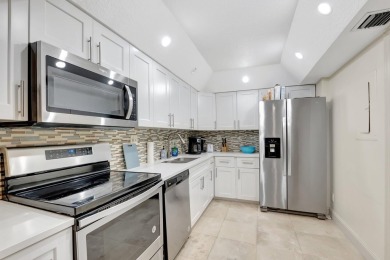 Enjoy the Florida lifestyle in this gorgeous 1st-floor condo in