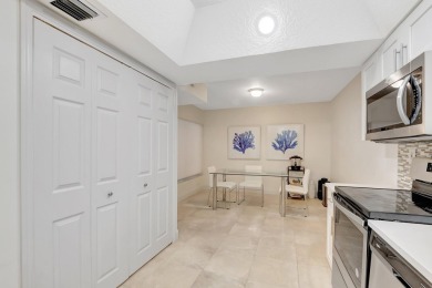 Enjoy the Florida lifestyle in this gorgeous 1st-floor condo in