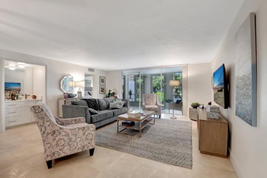 Enjoy the Florida lifestyle in this gorgeous 1st-floor condo in