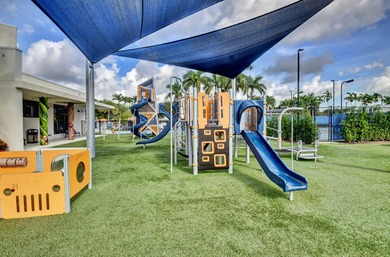 Enjoy the Florida lifestyle in this gorgeous 1st-floor condo in