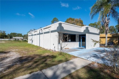 Excellent location! Great stucco retail building divided in 2