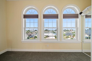 Nestled in the highly coveted Harbor Bluffs community, this