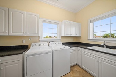 Nestled in the highly coveted Harbor Bluffs community, this