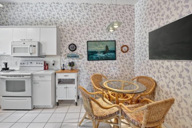 This two bedroom plus den, two full bath condo offers care-free