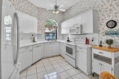 This two bedroom plus den, two full bath condo offers care-free