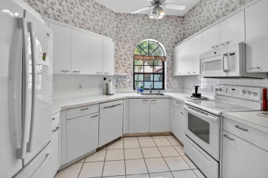 This two bedroom plus den, two full bath condo offers care-free