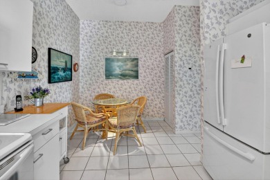 This two bedroom plus den, two full bath condo offers care-free