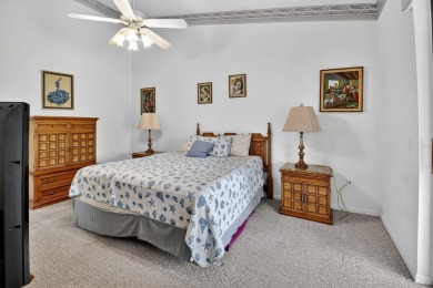 This two bedroom plus den, two full bath condo offers care-free