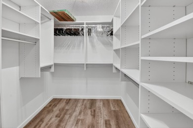 This two bedroom plus den, two full bath condo offers care-free