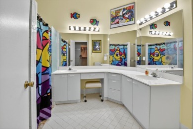 This two bedroom plus den, two full bath condo offers care-free