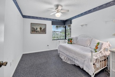This two bedroom plus den, two full bath condo offers care-free