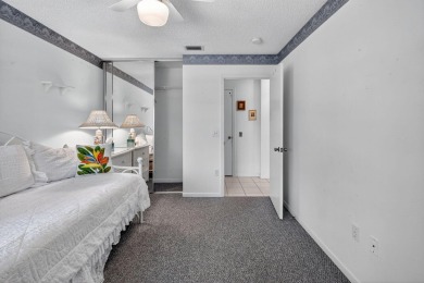 This two bedroom plus den, two full bath condo offers care-free