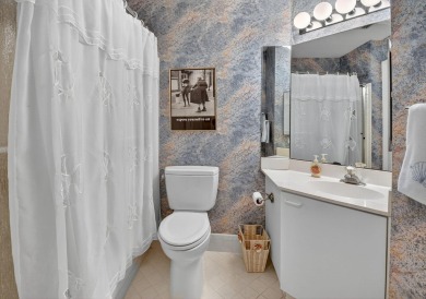 This two bedroom plus den, two full bath condo offers care-free