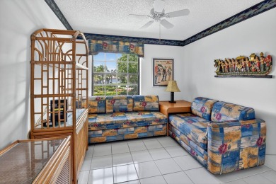 This two bedroom plus den, two full bath condo offers care-free