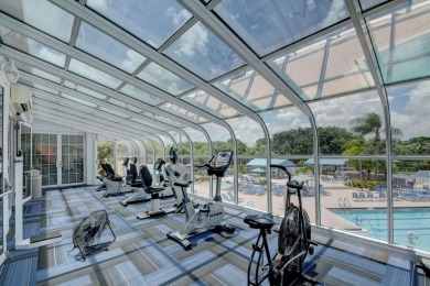 This two bedroom plus den, two full bath condo offers care-free