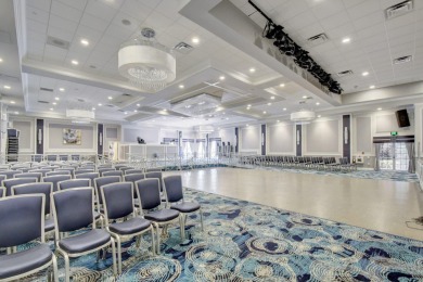 This two bedroom plus den, two full bath condo offers care-free