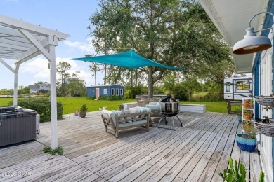 Waterfront living is within reach. This lovely home sits on a
