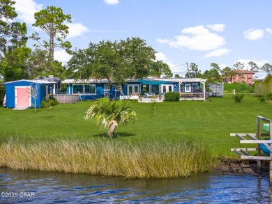 Waterfront living is within reach. This lovely home sits on a