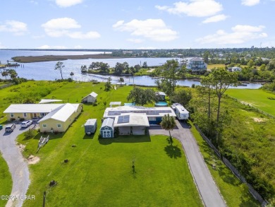 Waterfront living is within reach. This lovely home sits on a