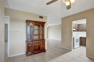 Move-in ready 1/1 top-floor unit with tile floors throughout