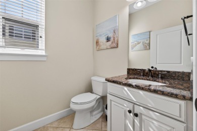 Impeccable coastal Luxury living within this premier gated