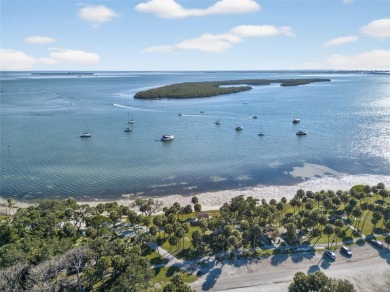 Impeccable coastal Luxury living within this premier gated